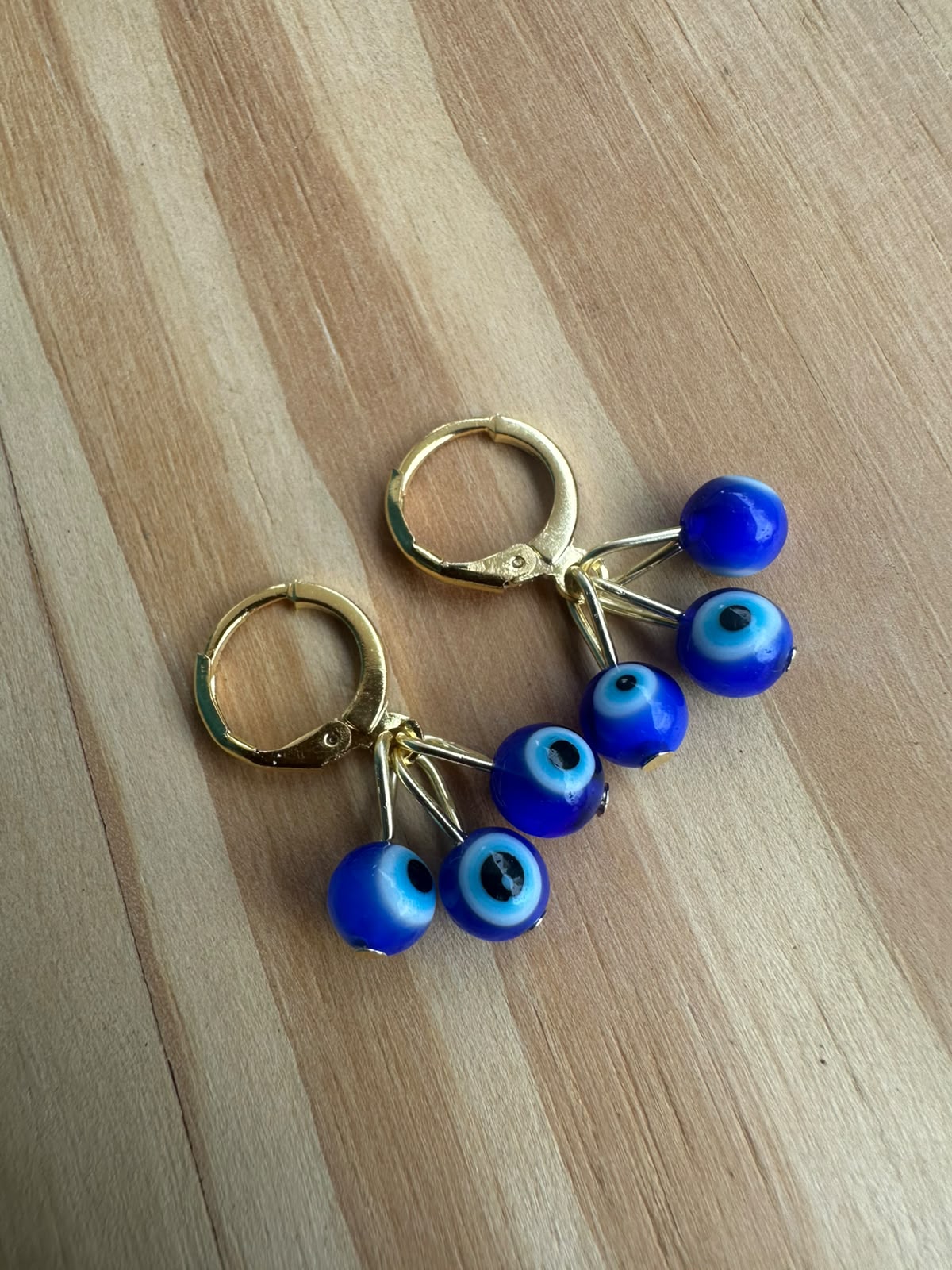 Brinco Olho Grego Murano com Hematita